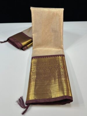 Presenting you all the soft Banarasi tissue silk saree with contrast weaving resham checks allover body of the saree with zari weaving contrast kanchi border